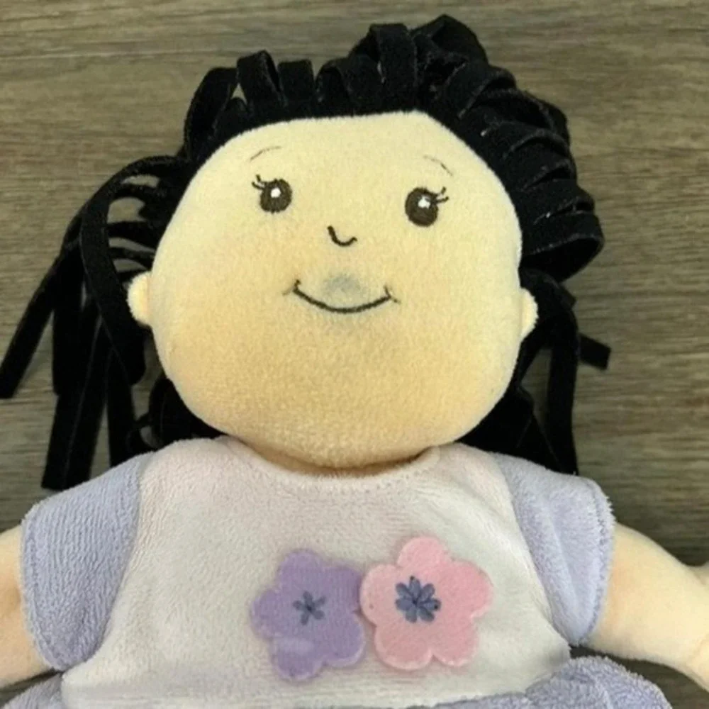 Manhattan Toy Co Baby Stella Doll Soft Plush Black Hair Purple Floral Dress Toy
